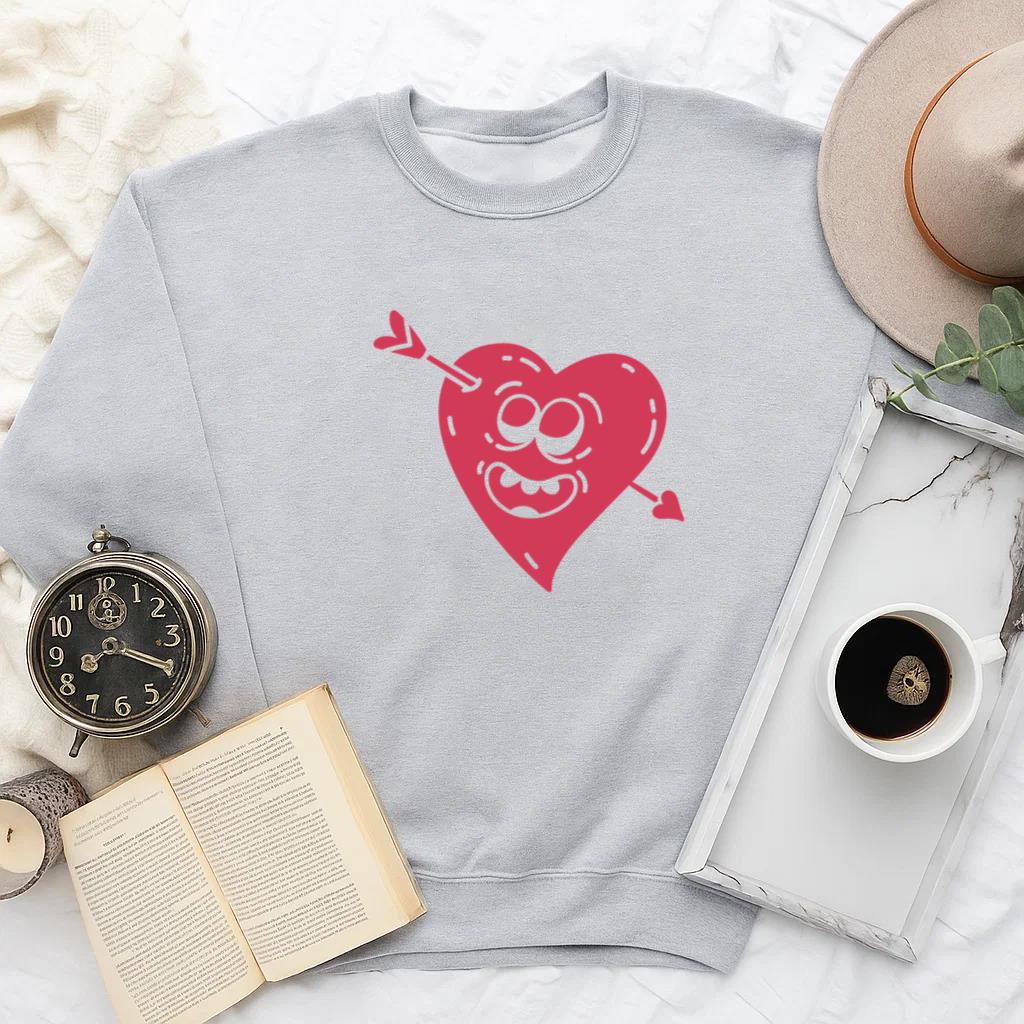 Whimsical Smiling Heart Design With Arrow Detail For Playful Apparel Design Sweatshirt